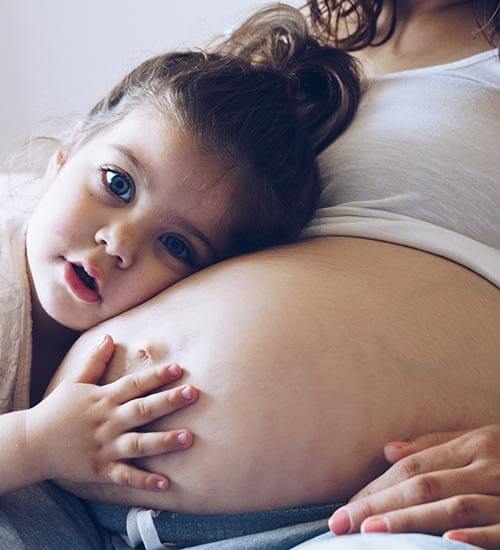 Pregnant mother with child, birth tissue donor